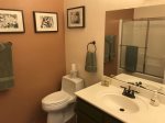The bathroom has a single vanity with a bath/shower combo